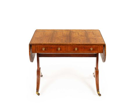 A Regency figured rosewood and satinwood banded sofa table, with two frieze drawers on standard end supports, downswept legs 