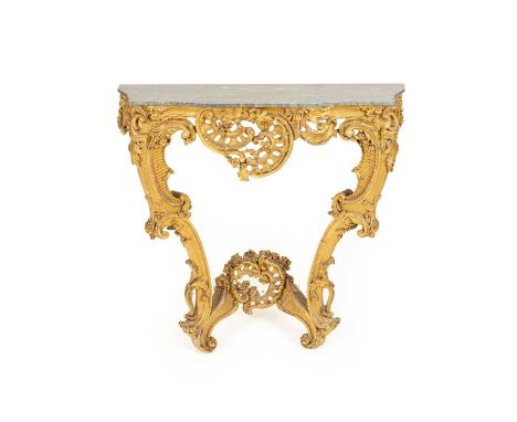 A mid Victorian gilt gesso serpentine console table with blue turquin marble top, 91cm high, 98cm wide, 50cm deep