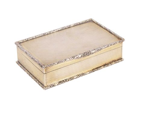 An Edwardian silver gilt cigarette box, Goldsmiths &amp; Silversmiths Co Ltd., London 1908, engine turned decoration througho