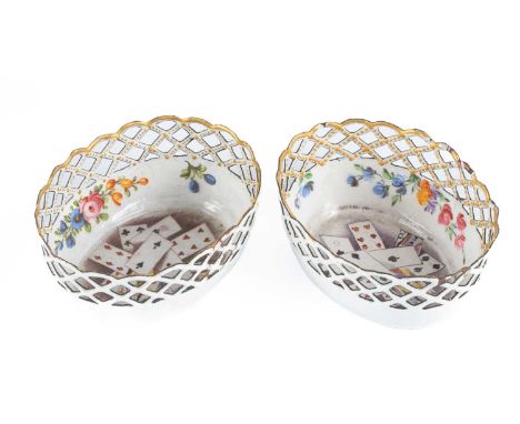 A pair of south Staffordshire enamel bonbon dishes, circa 1770, of oval form, each with pierced lattice borders and painted w