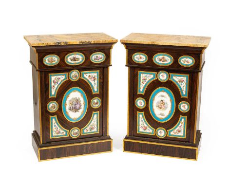 A pair of Napoleon III calamander pier cabinets, the fronts set with Sèvres style porcelain panels, each with marble top abov