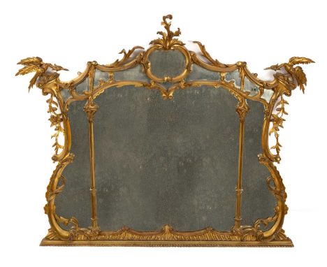A giltwood overmantel mirror, late 19th Century, of Chippendale design, the central plate surrounded by marginal plates, the 