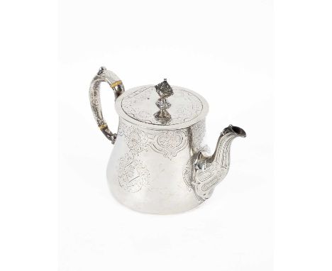 A Victorian silver teapot, Robert Garrard, London 1853, the flat hinged cover with finial, the scroll handle with ivory heat 