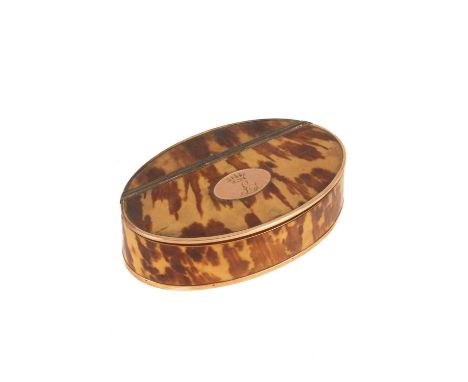 A George III gold mounted tortoiseshell snuff box of oval shape, the lid inset with an oval panel engraved with the letter L 