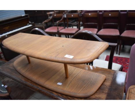 A small Ercol shelf, mid to light colour, width approx. 74cm, height 22cm