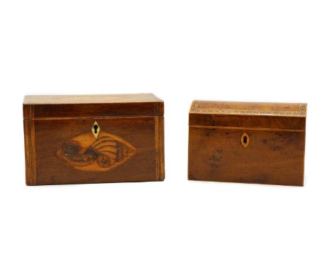 Two 19th century tea caddies, the first in burr yew with arched top. 16.5cm long, the second mahogany, with inlaid shell and 