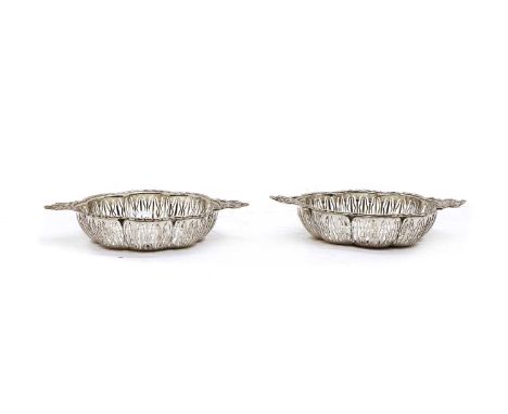 A pair of pierced twin handled silver bon bon dishes, E.S. Barnsley &amp; Co, Sheffield 1912, of lobed form with bow handles,