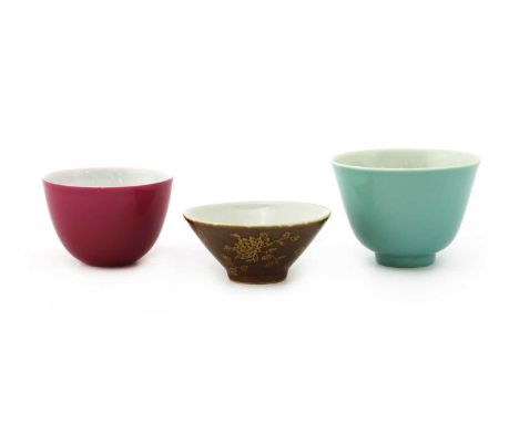 Three Chinese monochrome teacups, comprising: one of tapering form with a flared rim, under a turquoise glaze, six-character 