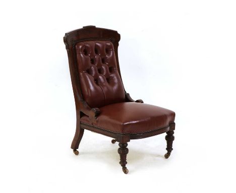 A mahogany nursing chair, late 19th century, the arched top over later button back deep red leather upholstery, raised on fro