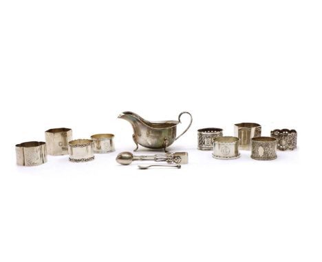 An assortment of silver items, to include nine napkin rings of varying design, including a pair of hexagonal form with engrav