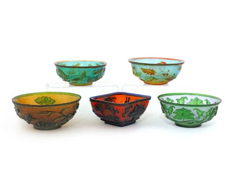 A collection of five Chinese overlay Peking glass bowls, 20th century, comprising: one decorated with geese in a lotus pond i