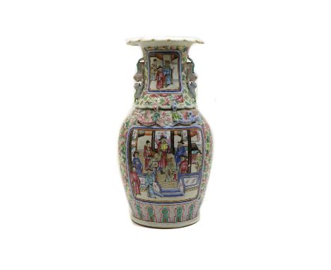 A Chinese Canton famille rose vase, c.1900, of baluster form and lobed rim, with applied chilong to the shoulder and Buddhist