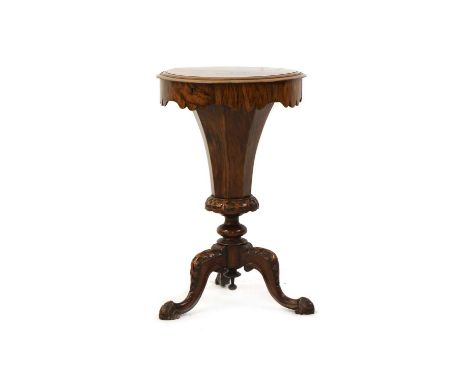 A Victorian figural walnut trumpet form work table, the hexagonal top enclosing fitted interior, on tripod base, 47cm wide, 7