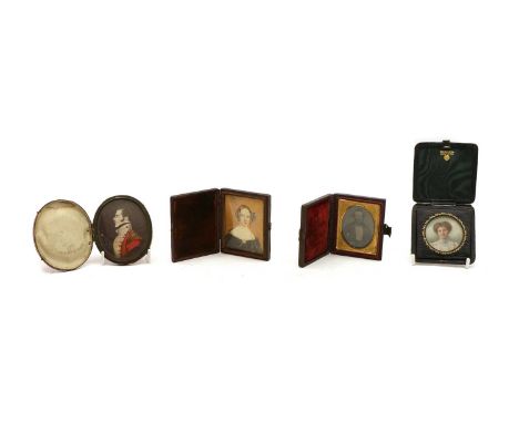 Three portrait miniatures on card, all in leather cases, 19th century, a late Victorian/Edwardian lady, circular, the green l