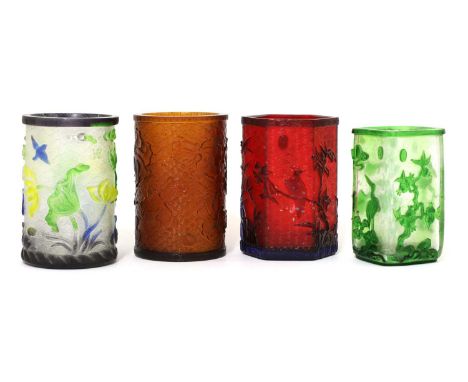 A collection of four Chinese overlay Peking glass brush pots, 20th century, comprising: one with geese in a lotus pond in yel