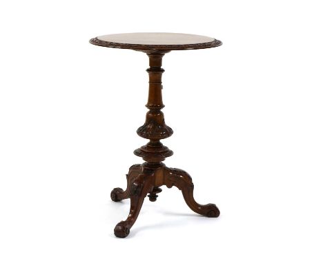 A Victorian burr walnut tripod table, the circular top with a carved border, the base with confirming carved decoration, 50cm