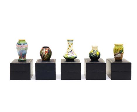 Five small modern Moorcroft pottery vases, and enamel vases, tallest 8.5cm, all boxed (5)Condition report: All appear OK