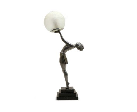 An Art Deco lamp modelled as a 1920s woman with outstretched arms, supporting a satin glass sphere on a stepped marble base, 