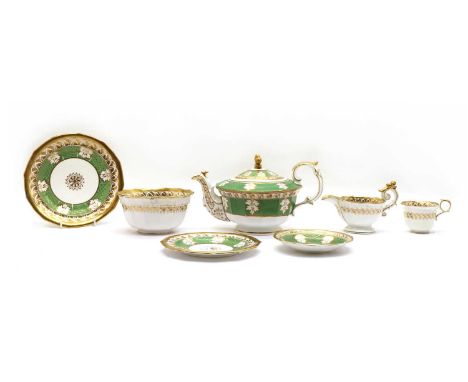 A part Staffordshire pottery tea service, c.1830s, with green and gilt decoration, tea pot and cover, milk jug, slops bowl, 8