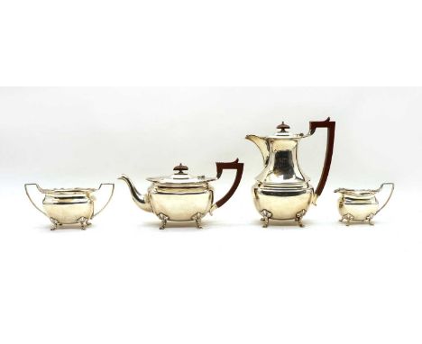 A silver four-piece tea set, by Addie Brothers Ltd, Birmingham 1923, consisting of a hot water jug, teapot, milk jug and crea