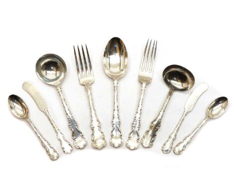 A composite English silver and Canadian white metal and metalware table service, with scroll, edged handles viz: the English 