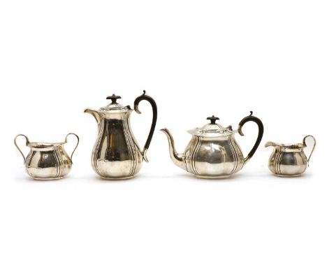 A silver four-piece tea set by James Deakin &amp; Sons, Sheffield 1930, consisting of a hot water jug, teapot, cream jug and 