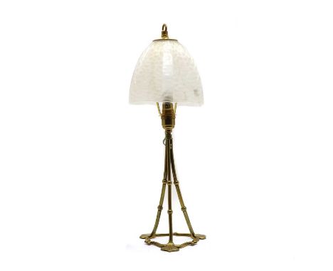 A brass table lamp, in the manner of WAS Benson, with an acid etched shade, 50cm highFrom the Simon Porter collection.Conditi