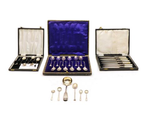 A cased set of twelve silver teaspoons, Sheffield 1914, together with a cased set of silver coffee bean spoons, a cased set o