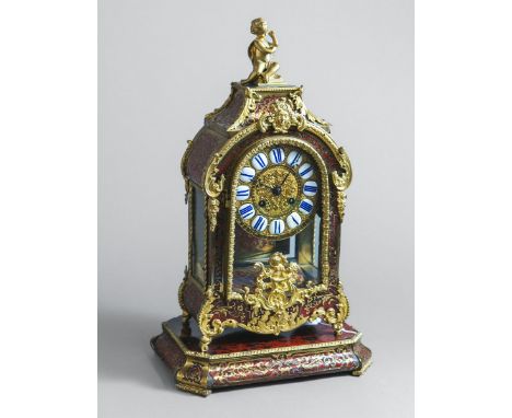 Boulle Tischuhr (Frankreich, um 1850), m. kl. flacher Konsole, H. ca. 44 cm. Funktionnicht geprüft.