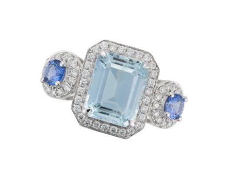 AN AQUAMARINE, SAPPHIRE AND DIAMOND RING set with an octagonal step cut aquamarine in a border of round brilliant cut diamond