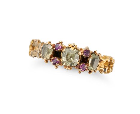 AN ANTIQUE CHRYSOLITE AND RUBY RING in yellow gold, set with three cushion cut chrysolites, accented by round cut rubies, no 