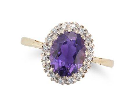 AN AMETHYST AND DIAMOND CLUSTER RING in 18ct yellow gold, set with an oval cut amethyst in a cluster of single cut diamonds, 