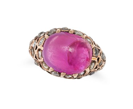 A RUBY AND DIAMOND RING set with an oval cabochon ruby accented by rose cut diamonds, no assay marks, size K1/2 / 5.5, 5.1g. 