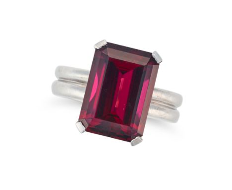 A RHODOLITE GARNET RING set with an octagonal step cut rhodolite garnet of 10.34 carats, no assay marks, size L1/2 / 6, 11.4g