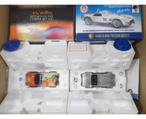 Franklin Mint. A boxed pair of 1:24 scale hard to find limited edition Shelby Cobra models comprising of Cobra 427 S/C "Mistr