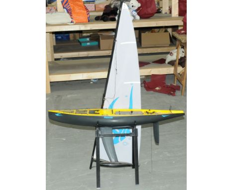 Imitation Carbon Fibre racing boat with motorized engine. Condition is generally but does need a clean (unchecked for complet