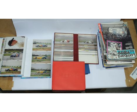 A large qty of racing related item to include Signed photos, unsigned photos, books and other items (see photo). Conditions a