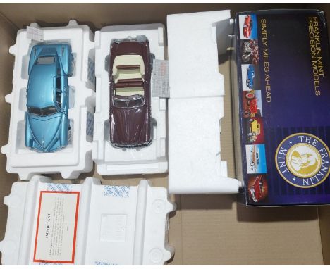 Franklin Mint. A partially boxed pair of 1:24 scale American classic models comprising of 1949 Buick Roadmaster in Burgundy w