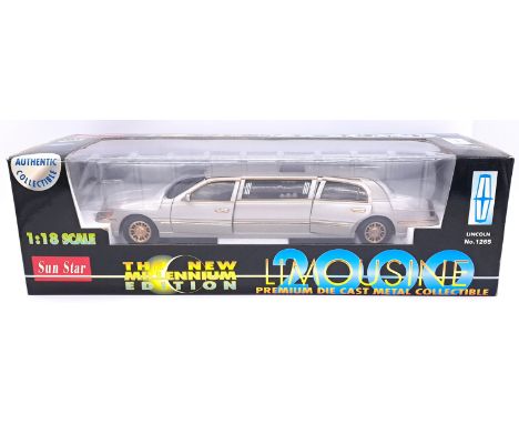 Sun Star - a boxed 1:18 Scale 1265 "The New Millennium Edition" Lincoln Limousine.&nbsp; In Metallic Grey with Gold alloy whe