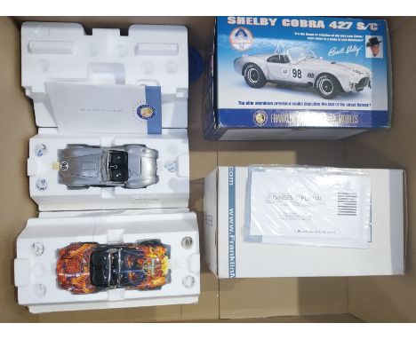 Franklin Mint. A boxed pair of 1:24 scale hard to find limited edition Shelby Cobra models comprising of Shelby Cobra "King O