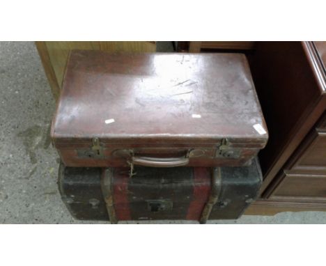 A vintage leather suitcase; and a canvas and battoned trunk 