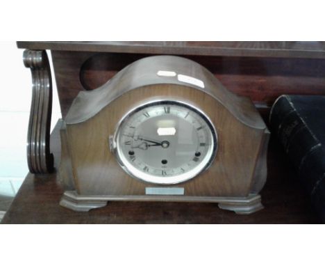A walnut cased three hole mantel clock