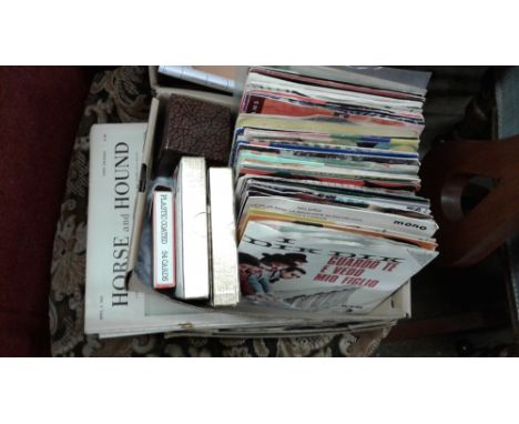 A collection of 45rpm records; playing cards etc.