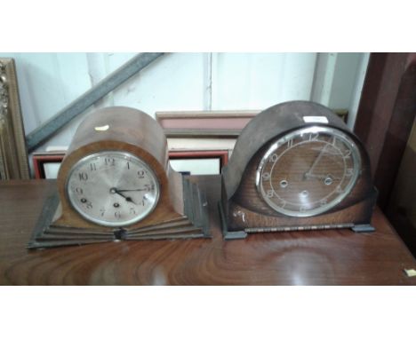 A oak cased three hole mantel clock together with one other three hole mantel clock