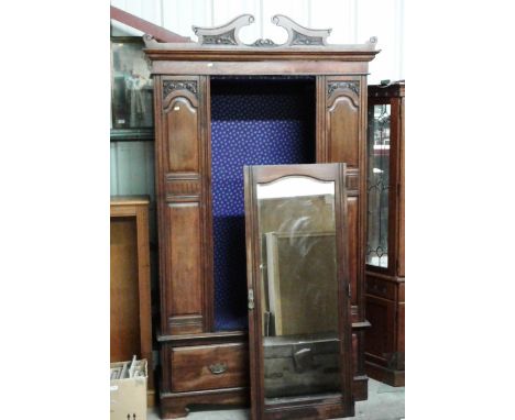 An Edwardian mahogany single door wardrobe fitted one long drawer