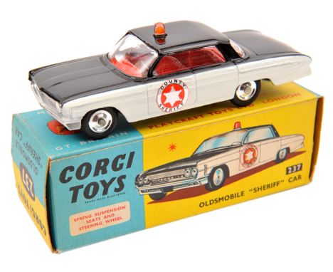 Corgi Toys Oldsmobile Super 88 ‘Sheriff’ Car (237). In black and white with red interior, ‘County Sheriff’ to front doors, li