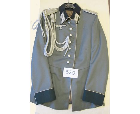 A German Army officer’s tunic,  with white piping to collar and cuffs white backing to shoulder straps, and silver bullion ai