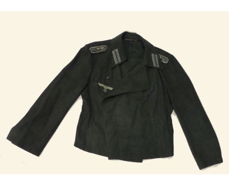 A German Army Assault Gunner’s special pattern cross over tunic, field grey with BeVo breast eagle, special type “Sonder Fueh
