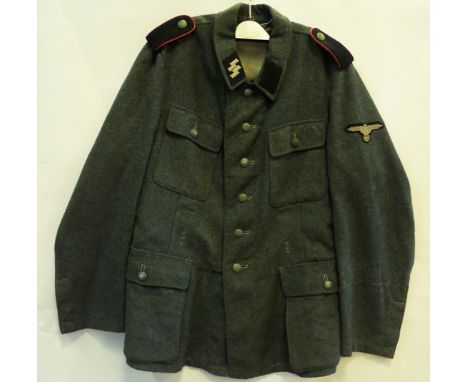 A German Waffen SS M1943 Artillery man’s tunic, made from captured Italian material, with grey cotton SS runes collar patch a