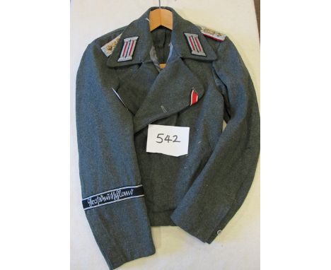 A German Army Assault Gunner officer’s special pattern field grey cross over tunic of the Grossdeutschland Division, with sil
